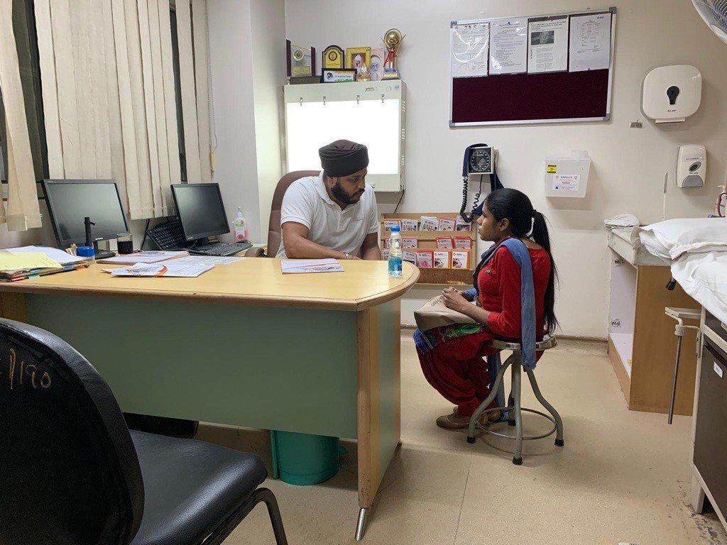 Patient consultation at SPS Hospital during a Seva Spine mission